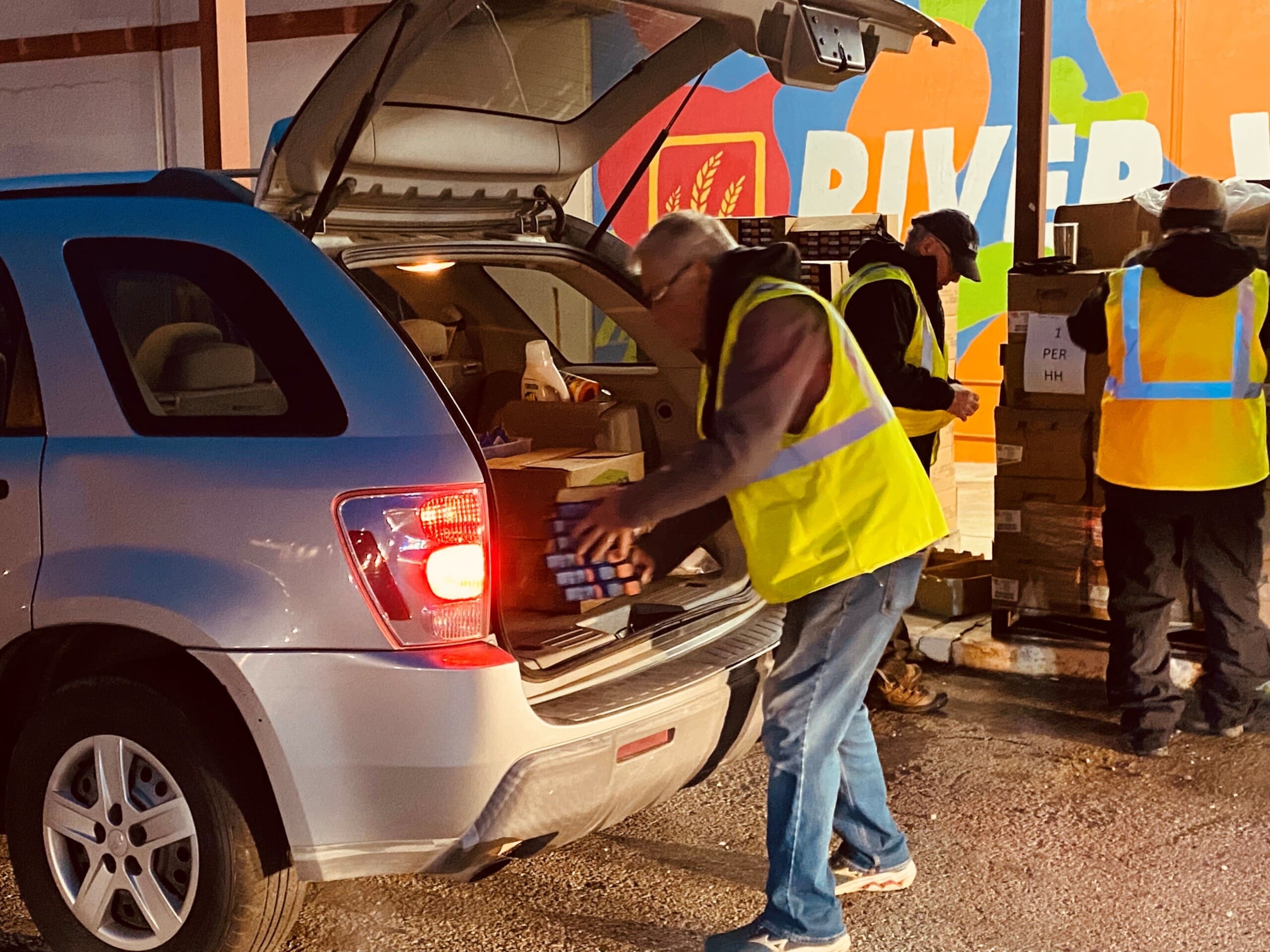 Commodities4 32123 A volunteer loads items into a vehicle at a USDA commodity distribution event in Fort Smith in this undated photo.